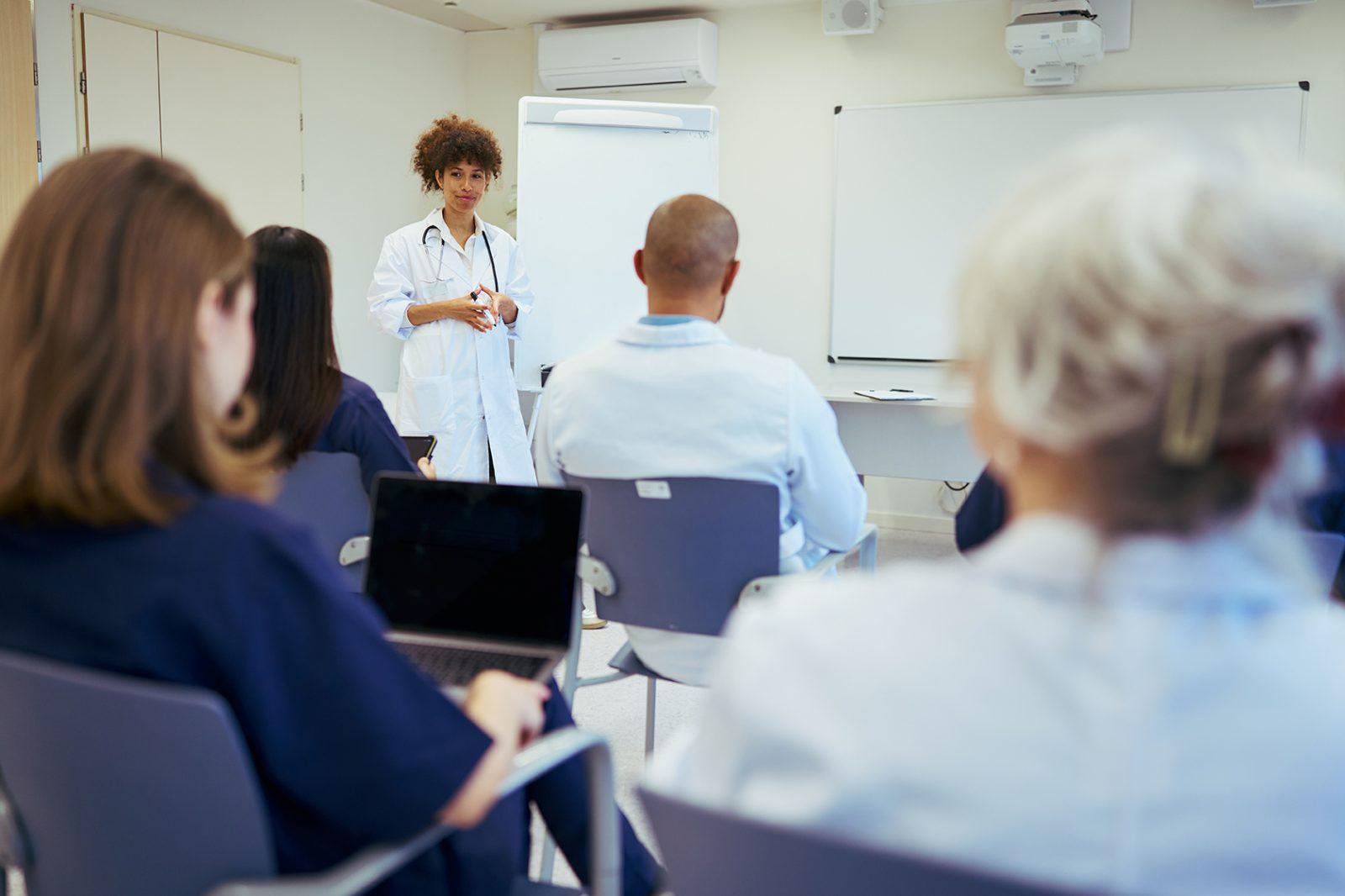 Medical team meeting: doctor leading training session for healthcare professionals blog thumbnail
