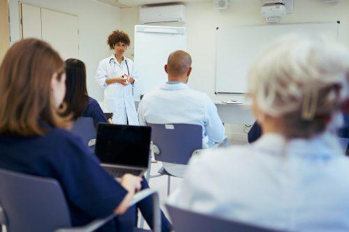 Medical team meeting: doctor leading training session for healthcare professionals blog thumbnail